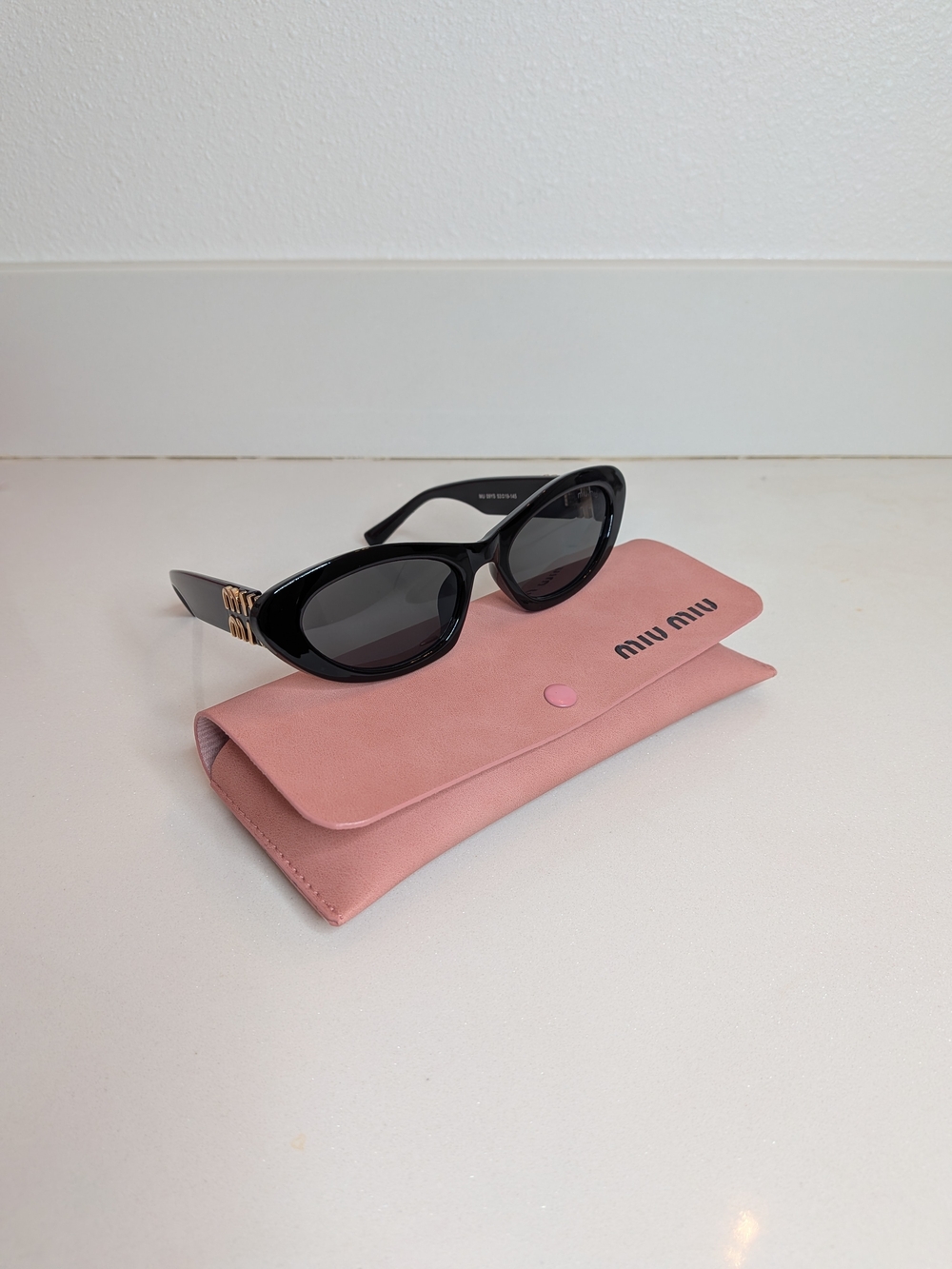 Miu Miu Women's Black Oval Cat Eye Sunglasses - Picture 4 of 13